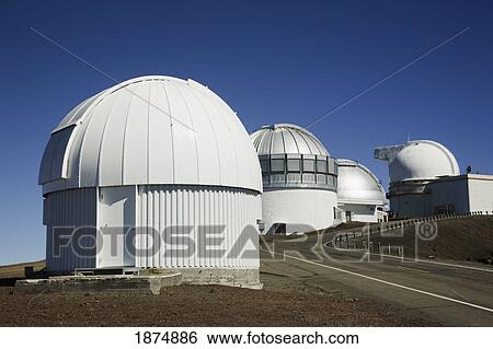 Stock Photograph - Observatories On The Summit Of Mauna Kea Are Perched Above An Inversion Layer, Attaining Clear Skies; Hawaii, Usa. Fotosearch