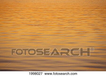 Ocean Shimmering Surface With Sunset Reflections Beautiful Orange Color View Large Photo Image Stock Photo - Ocean Shimmering Surface With Sunset Reflections Beautiful Orange Color. Fotosearch