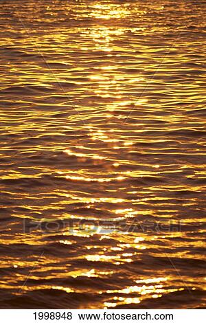 Ocean Texture Ripples At Sunset, Golden Yellow Waters B1447 View Large Photo Image Stock Photo - Ocean Texture Ripples At Sunset, Golden Yellow Waters B1447. Fotosearch