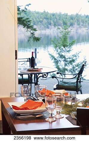 Stock Photo - Ocean View From West Coast Home Dining Room; Mayne Island, British Columbia, Canada. Fotosearch