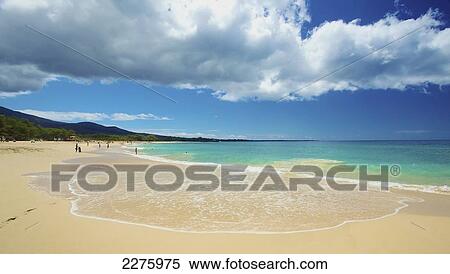 Ocean water washes up on the sand on a beach; Hawaii, United States of America View Large Photo Image Stock Photography - Ocean water washes up on the sand on a beach; Hawaii, United States of America. Fotosearch