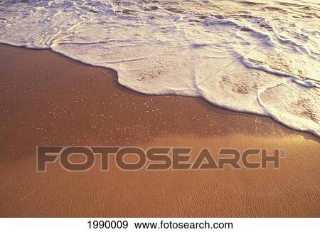 Stock Photo - Ocean Whitewash Shore Break On The Sand. Fotosearch