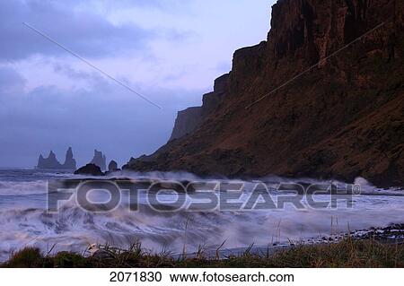 Stock Image - Ocean With The Sea Stacks In Distance, Vik, Southern Iceland. Fotosearch