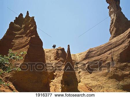 Ochre Cliffs With Walkers View Large Photo Image Stock Photo - Ochre Cliffs With Walkers. Fotosearch