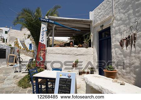 Stock Photography - Octopus hanging outside a taverna in Faros on the Southeastern coast of Sifnos; Faros, Sifnos, Cyclades, Greek Islands, Greece. Fotosearch