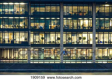 Stock Photo - Office Building Exterior Illuminated At Dusk, Full Frame, London, England, Uk. Fotosearch