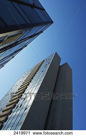Office buildings against a blue sky; Hamburg, Germany View Large Photo Image Stock Image - Office buildings against a blue sky; Hamburg, Germany. Fotosearch