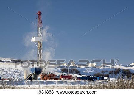 Stock Photo - Oil Drilling Rig In Winter; Longview, Alberta, Canada. Fotosearch