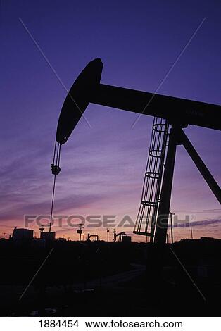 Oil Field Pumps In Silhouette View Large Photo Image Picture - Oil Field Pumps In Silhouette. Fotosearch
