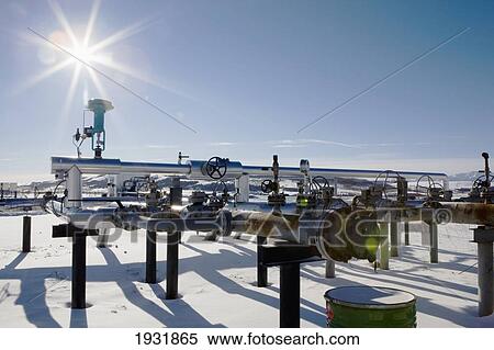 Stock Photography - Oil Industry Pipes In Winter; Longview, Alberta, Canada. Fotosearch