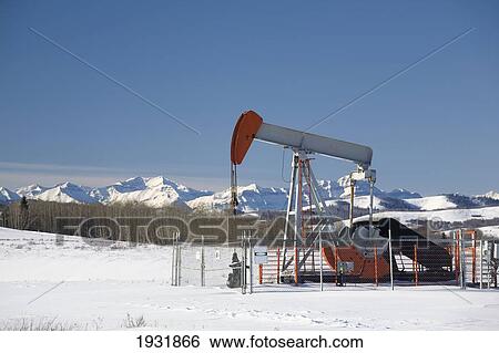 Stock Photograph - Oil Industry Pumpjack In Winter; Longview, Alberta, Canada. Fotosearch