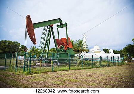 Oil pump 'nodding donkey'; Seria, Brunei View Large Photo Image Stock Image - Oil pump 'nodding donkey'; Seria, Brunei. Fotosearch