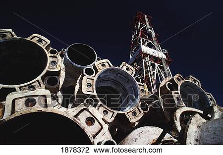 Stock Image - Oil Rig With Barrels. Fotosearch