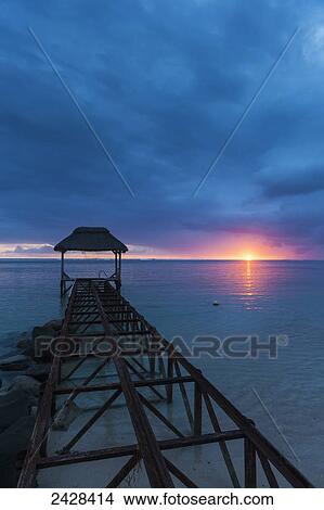 Picture - Old abandoned pier at dusk; Republic of Mauritius. Fotosearch