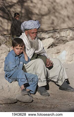 Old Afghan Man And Boy In Kharwalang, Vardak Province, Afghanistan View Large Photo Image Stock Photo - Old Afghan Man And Boy In Kharwalang, Vardak Province, Afghanistan. Fotosearch
