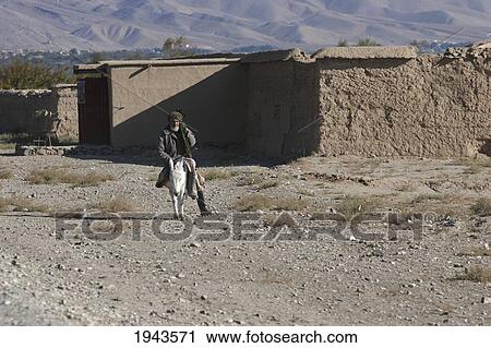 Old Afghan Man On A Donkey In Pol-E Matak, Parwan Province, Afghanistan View Large Photo Image Stock Image - Old Afghan Man On A Donkey In Pol-E Matak, Parwan Province, Afghanistan. Fotosearch