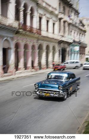 Stock Image - Old American Cars In Street. Fotosearch