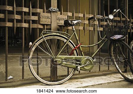 Picture - Old Bicycle By Fence; Florence, Italy. Fotosearch
