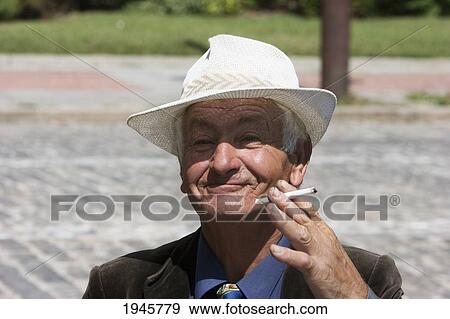 Stock Photo - Old Bulgarian man at the flea market, Sofia, Bulgaria. Fotosearch