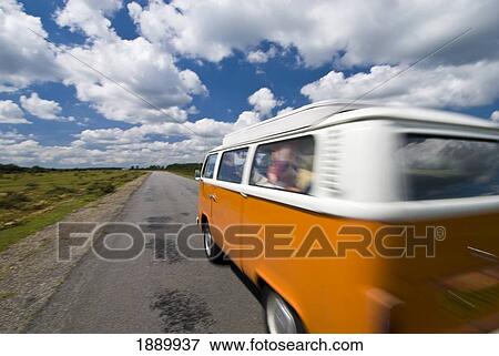 Stock Photo - Old Campervan Driving Through Heathland, Blurred Motion. Fotosearch