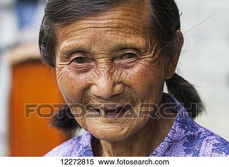 Stock Photography - Old Chinese woman, Xidi, Anhui, China. Fotosearch
