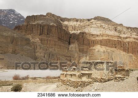 Stock Photograph - Old Chortens (Stupas) Along Kali Gandaki River; Chhsuang (Chuksang), Upper Mustang Valley, Nepal. Fotosearch