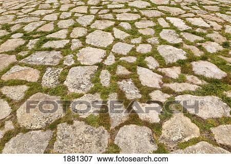 Stock Photo - Old Cobbled Path With Grass Between The Stones; Segovia, Segovia Province, Spain. Fotosearch