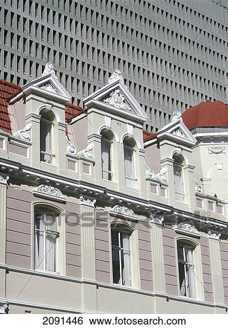 Old Colonial Building In Front Of Large Modern Concrete Office Block, Cape Town, South Africa. View Large Photo Image Stock Photograph - Old Colonial Building In Front Of Large Modern Concrete Office Block, Cape Town, South Africa.. Fotosearch