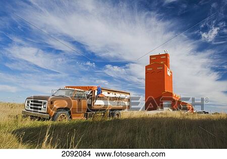 Old Farm Truck And Grain Elevator; Stoughton Saskatchewan Canada View Large Photo Image Picture - Old Farm Truck And Grain Elevator; Stoughton Saskatchewan Canada. Fotosearch