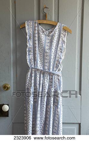 Old-fashioned apron hanging on a kitchen door; Ontario, Canada View Large Photo Image Stock Photograph - Old-fashioned apron hanging on a kitchen door; Ontario, Canada. Fotosearch