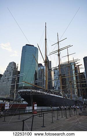 Stock Image - Old fashioned boat in front of financial district, Manhattan; New York City, New York, United States of America. Fotosearch