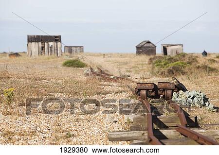 Stock Image - Old Fishermens Huts On The Beach In Dungeness, Kent, Uk. Fotosearch