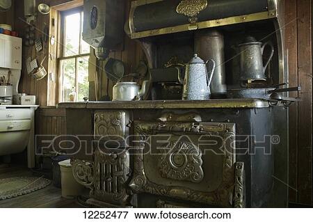 Old French settlement kitchen and antique wood oven; Trochu, Alberta, Canada View Large Photo Image Stock Photo - Old French settlement kitchen and antique wood oven; Trochu, Alberta, Canada. Fotosearch