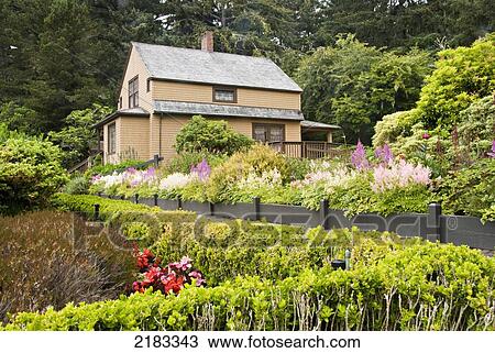 Stock Image - Old House And Flower Gardens; Oregon United States Of America. Fotosearch