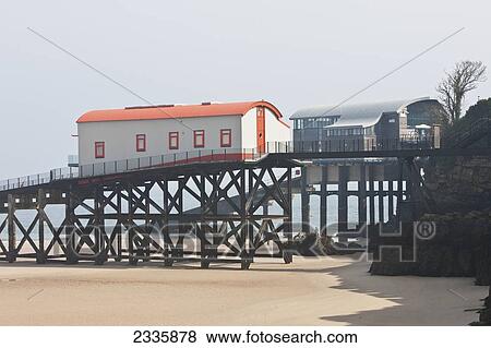 Old Lifeboat Station With New One In Background; Tenby, Pembrokeshire Coast Path, Wales, United Kingdom View Large Photo Image Stock Photo - Old Lifeboat Station With New One In Background; Tenby, Pembrokeshire Coast Path, Wales, United Kingdom. Fotosearch