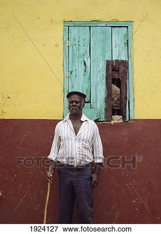 Stock Photo - Old Man Outside His House. Fotosearch