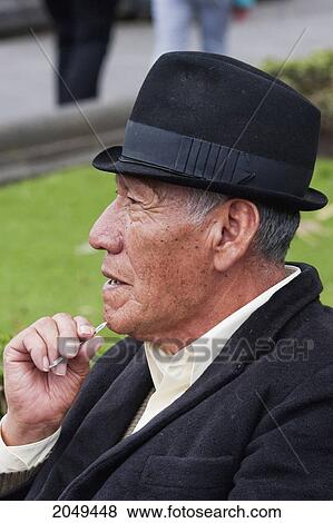 Old Man Sitting On A Bench On Plaza Grande, Quito, Pichincha, Ecuador View Large Photo Image Stock Photo - Old Man Sitting On A Bench On Plaza Grande, Quito, Pichincha, Ecuador. Fotosearch