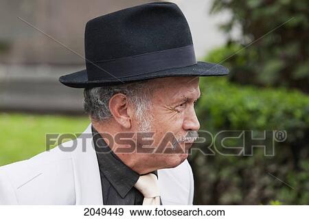 Stock Photo - Old Man Sitting On A Bench On Plaza Grande, Quito, Pichincha, Ecuador. Fotosearch