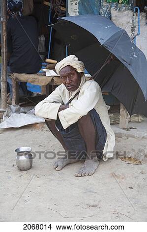 Old Man Under An Umbrella, Bihar, India View Large Photo Image Picture - Old Man Under An Umbrella, Bihar, India. Fotosearch