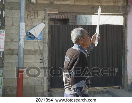 Picture - Old Man With A Candle In The Easter Sunday Procession To The Church, San Luis, Sacatep. Fotosearch