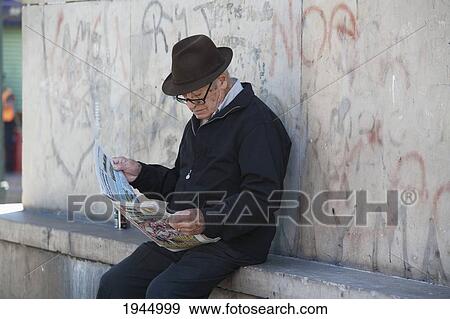 Old man with newspaper in Barrio La Boca, Buenos Aires, Capital Federal, Argentina View Large Photo Image Stock Photo - Old man with newspaper in Barrio La Boca, Buenos Aires, Capital Federal, Argentina. Fotosearch