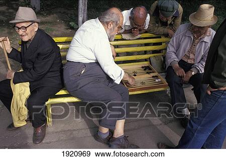 Old Men Playing Backgammon On A Park Bench View Large Photo Image Stock Photo - Old Men Playing Backgammon On A Park Bench. Fotosearch