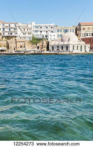 Stock Image - Old mosque in Venetian harbour; Chania, Crete, Greece. Fotosearch