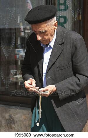 Stock Photo - Old Muslim Man Holding Prayer Beads, Sarajevo, Bosnia And Herzegovina. Fotosearch