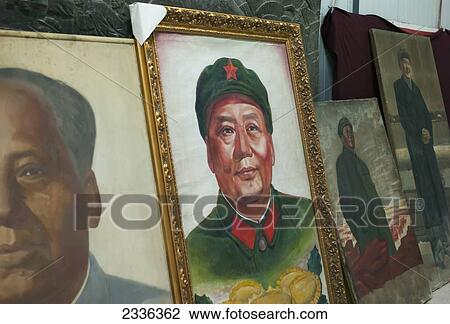 Stock Image - Old Photographs Of Chinese Leaders Displayed In A Row At Panjiayuan Antique Market; Beijing, China. Fotosearch