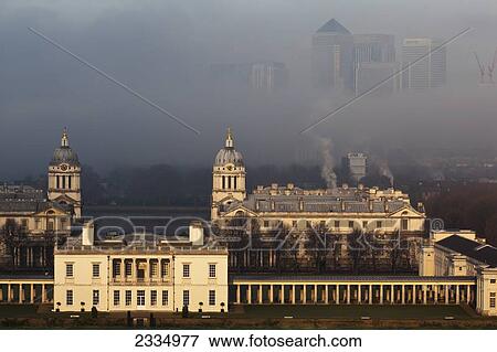Old Royal Naval College And Canary Wharf On Foggy Winter Morning Seen From Greenwich Park; Greenwich, London, England, Uk View Large Photo Image Stock Photo - Old Royal Naval College And Canary Wharf On Foggy Winter Morning Seen From Greenwich Park; Greenwich, London, England, Uk. Fotosearch