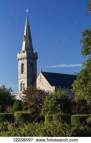 Stock Photo - Old stone church steeple with blue sky; Kilrush, County Clare, Ireland. Fotosearch