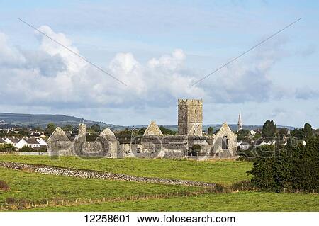 Old stone ruin with church tower and roofless buildings with clouds and blue sky; Ennis, County Clare, Ireland View Large Photo Image Stock Image - Old stone ruin with church tower and roofless buildings with clouds and blue sky; Ennis, County Clare, Ireland. Fotosearch
