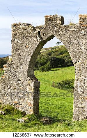 Old stone wall with arched entrance way; Clifden, County Galway, Ireland View Large Photo Image Stock Photo - Old stone wall with arched entrance way; Clifden, County Galway, Ireland. Fotosearch