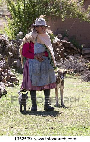 Stock Photo - Old Tarabuco woman with her dog and cat, Jatun Yampara Indigenous Community, Chuquisaca Department, Bolivia. Fotosearch